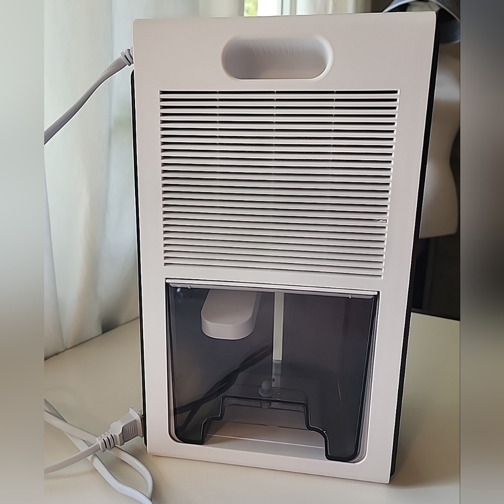 Small Portarble Dehumidifier Model CT2 95 oz. White. With Auto Shutoff.